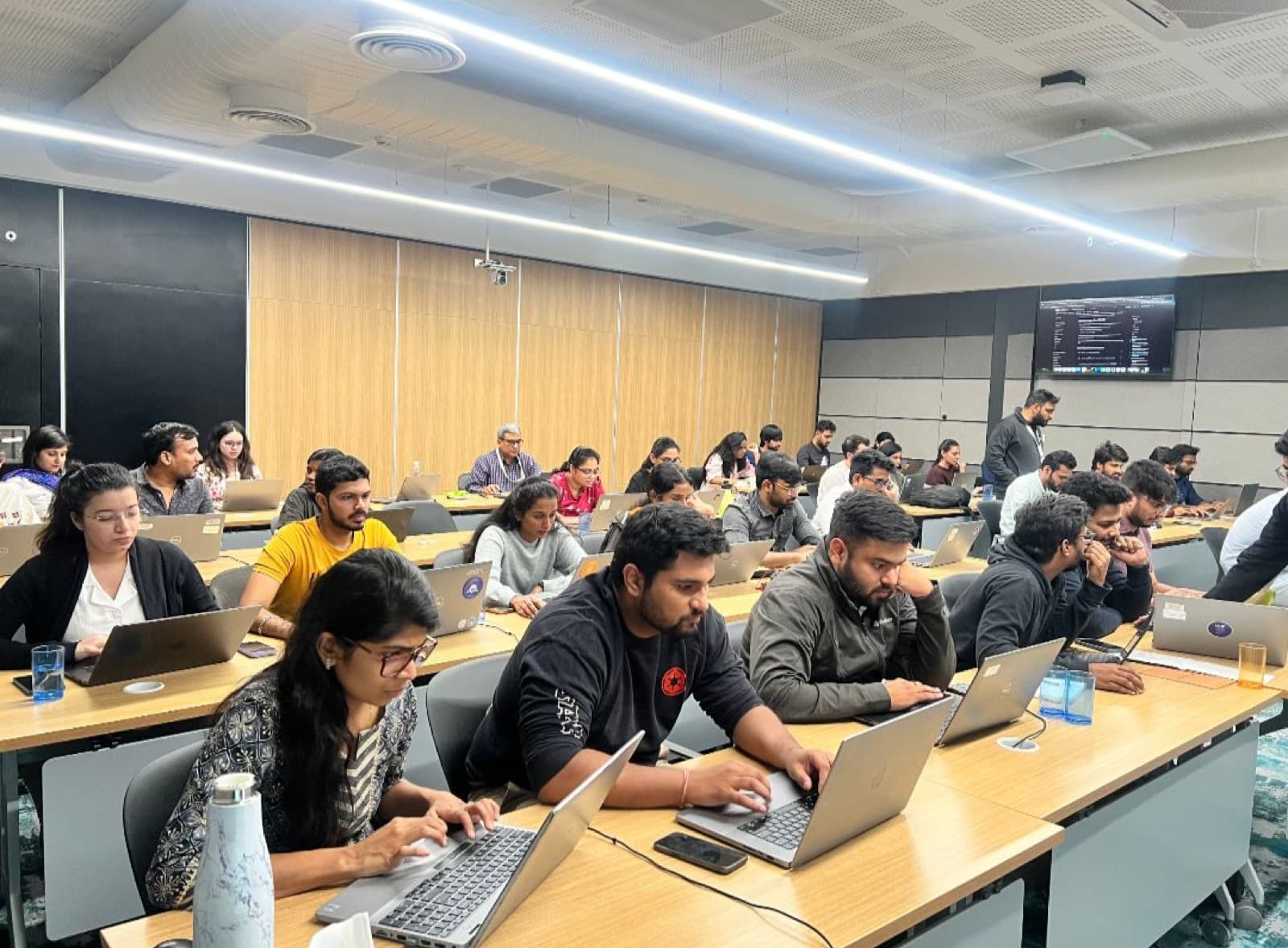 Engineers in a hands-on AI Anytime corporate AI bootcamp
